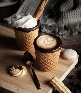 Two Cup2Eat chocolate-rimmed wafer cups with coffee